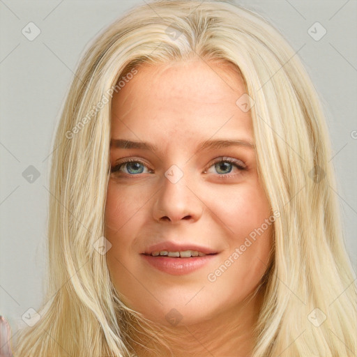 Joyful white young-adult female with long  blond hair and blue eyes