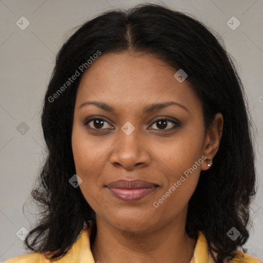 Joyful black young-adult female with long  brown hair and brown eyes
