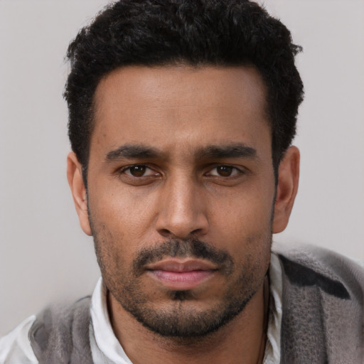 Neutral white young-adult male with short  black hair and brown eyes