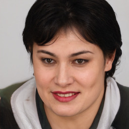 Joyful white young-adult female with medium  brown hair and brown eyes