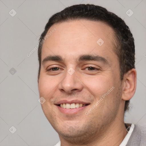 Joyful white young-adult male with short  brown hair and brown eyes