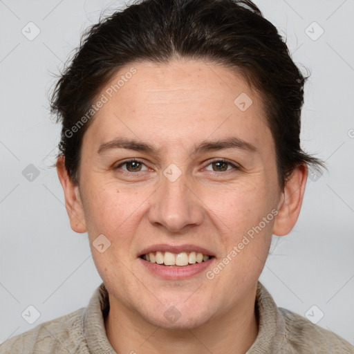 Joyful white adult female with short  brown hair and grey eyes