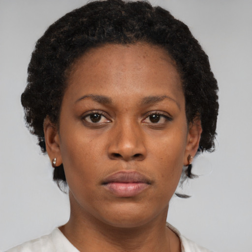 Neutral black young-adult female with short  brown hair and brown eyes
