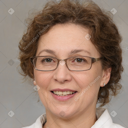 Joyful white adult female with medium  brown hair and blue eyes