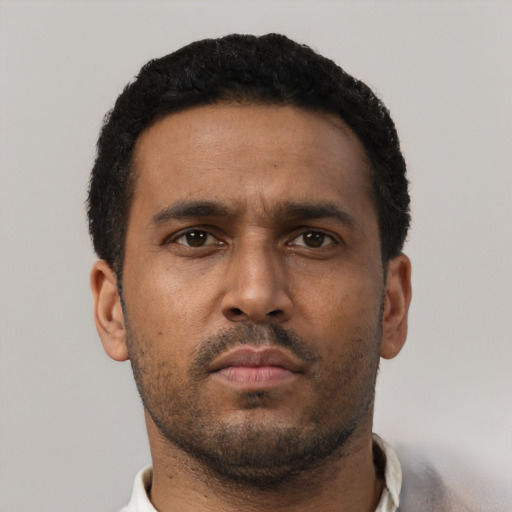 Neutral black young-adult male with short  black hair and brown eyes