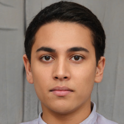 Neutral white young-adult male with short  black hair and brown eyes
