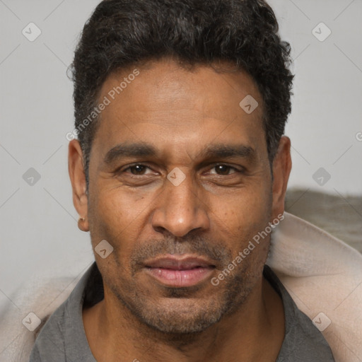 Neutral latino adult male with short  black hair and brown eyes