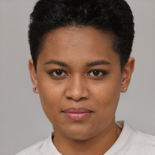 Joyful black young-adult female with short  black hair and brown eyes