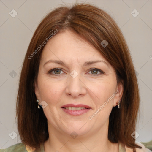 Joyful white adult female with medium  brown hair and brown eyes