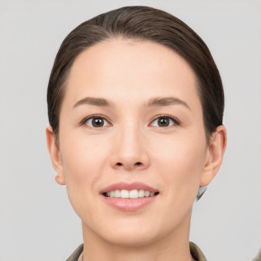 Joyful white young-adult female with short  brown hair and brown eyes