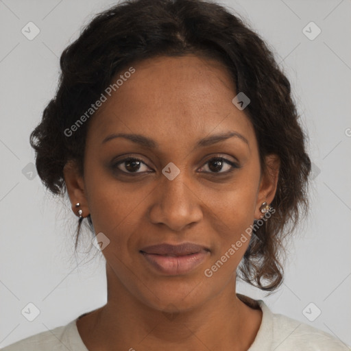 Joyful black adult female with medium  brown hair and brown eyes