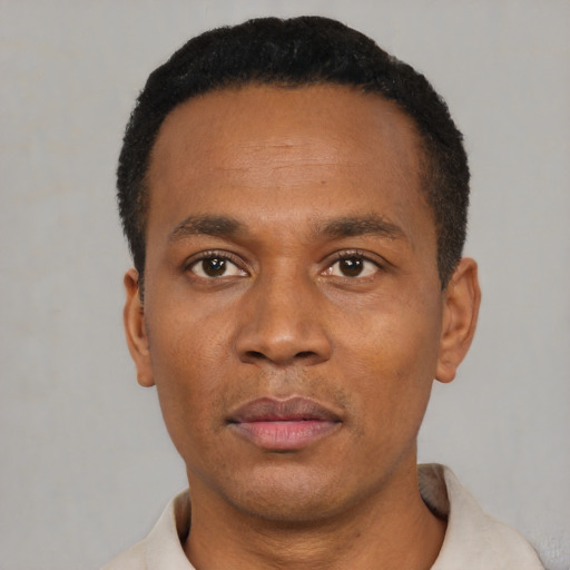 Neutral latino adult male with short  black hair and brown eyes