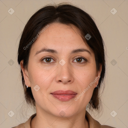 Joyful white adult female with medium  brown hair and brown eyes