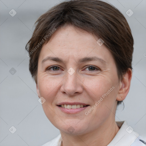 Joyful white adult female with short  brown hair and brown eyes