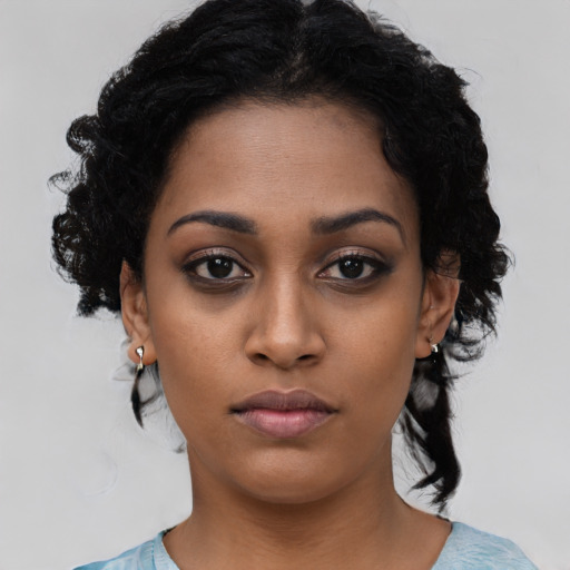 Neutral black young-adult female with medium  black hair and brown eyes