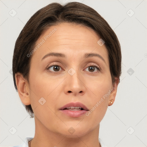 Joyful white adult female with short  brown hair and brown eyes