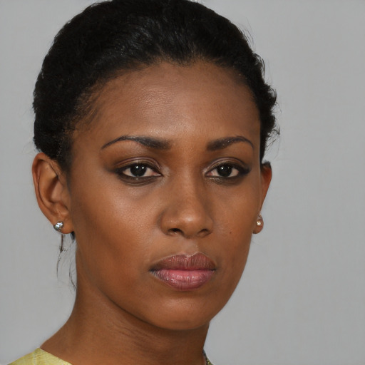 Neutral black young-adult female with short  brown hair and brown eyes