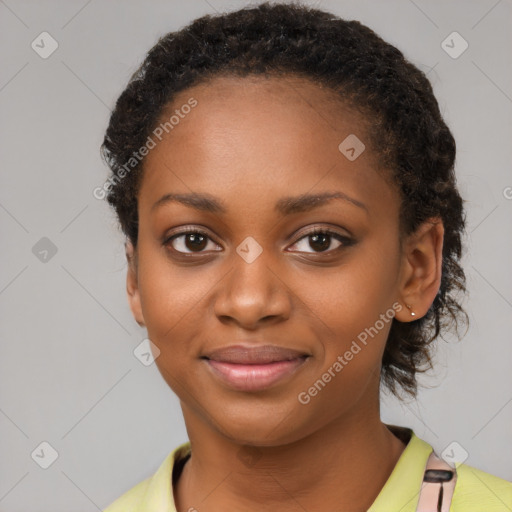 Joyful black young-adult female with short  black hair and brown eyes