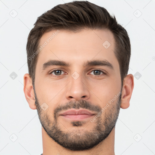 Joyful white young-adult male with short  brown hair and brown eyes