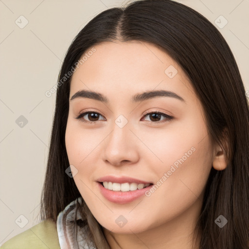 Joyful white young-adult female with long  brown hair and brown eyes