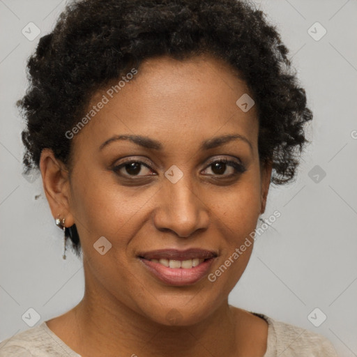 Joyful black adult female with short  brown hair and brown eyes