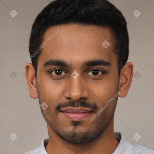 Joyful black young-adult male with short  black hair and brown eyes