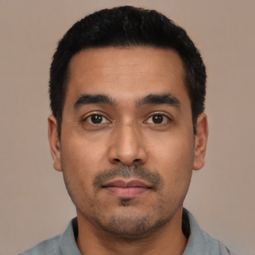 Neutral latino young-adult male with short  black hair and brown eyes