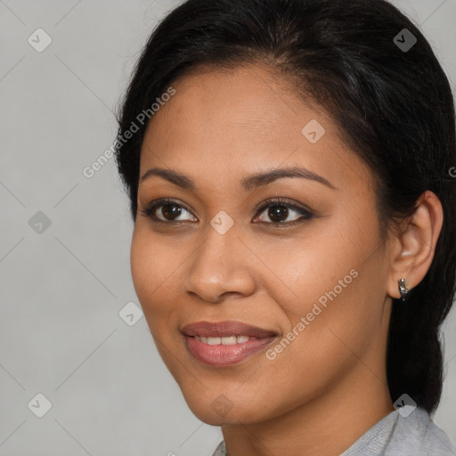 Joyful latino young-adult female with long  brown hair and brown eyes