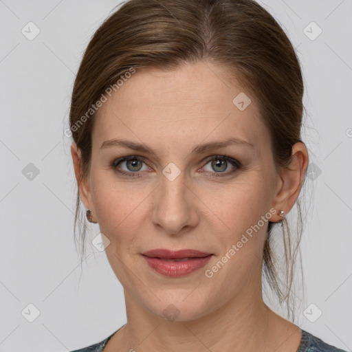 Joyful white young-adult female with medium  brown hair and blue eyes