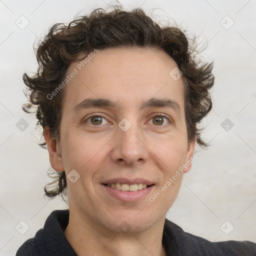 Joyful white adult male with short  brown hair and grey eyes