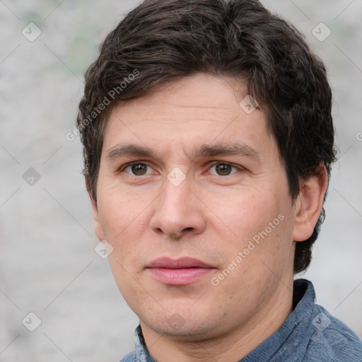 Joyful white adult male with short  brown hair and grey eyes