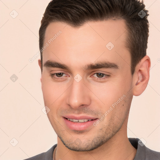 Joyful white young-adult male with short  brown hair and brown eyes