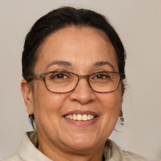 Joyful white middle-aged female with medium  brown hair and brown eyes