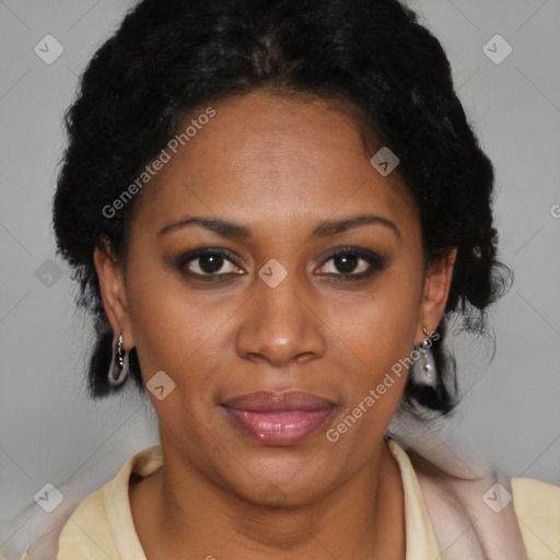 Joyful black adult female with short  brown hair and brown eyes