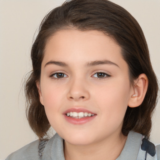 Joyful white child female with medium  brown hair and brown eyes