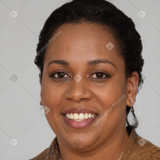 Joyful black adult female with short  black hair and brown eyes