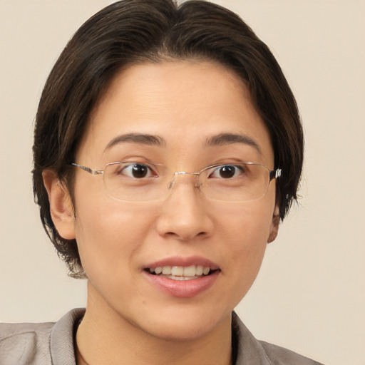 Joyful white adult female with short  brown hair and brown eyes