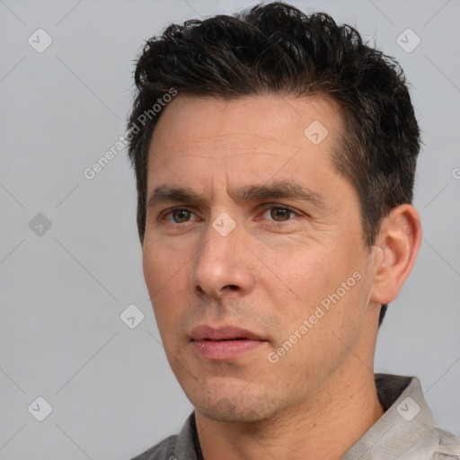 Neutral white adult male with short  brown hair and brown eyes