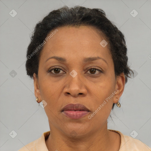 Joyful black adult female with short  brown hair and brown eyes