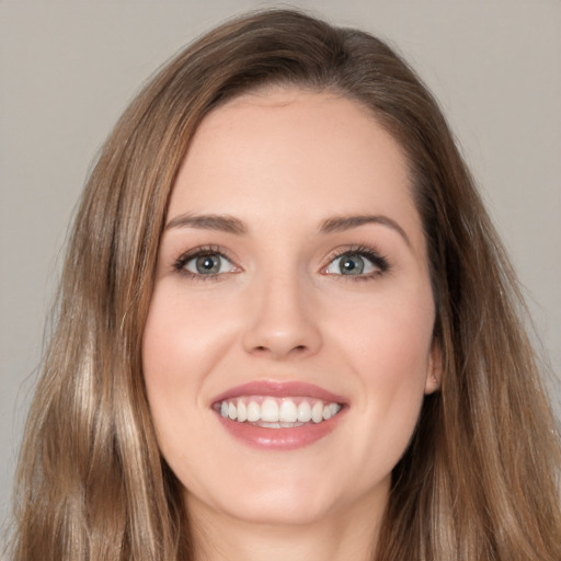 Joyful white young-adult female with long  brown hair and brown eyes