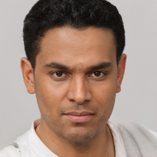 Neutral latino young-adult male with short  brown hair and brown eyes
