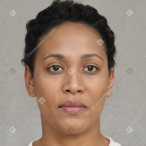 Joyful black young-adult female with short  brown hair and brown eyes