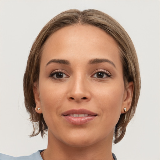 Joyful white young-adult female with medium  brown hair and brown eyes