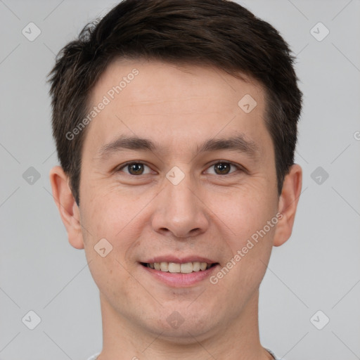 Joyful white adult male with short  brown hair and brown eyes