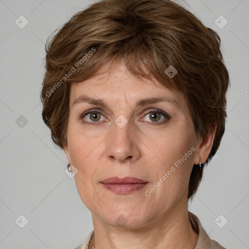 Joyful white adult female with medium  brown hair and grey eyes