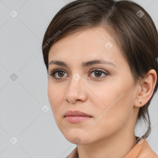 Neutral white young-adult female with medium  brown hair and brown eyes