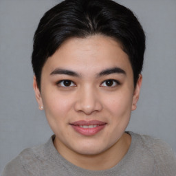 Joyful asian young-adult female with short  brown hair and brown eyes