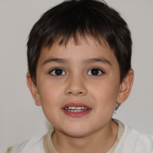 Joyful white child male with short  brown hair and brown eyes