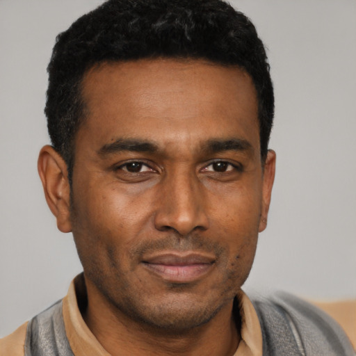 Neutral black young-adult male with short  black hair and brown eyes