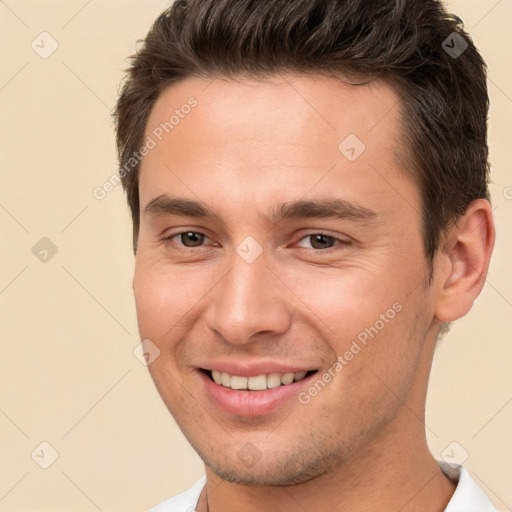 Joyful white young-adult male with short  brown hair and brown eyes